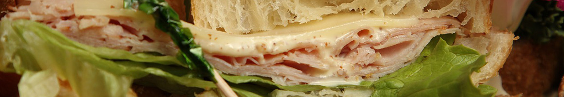 Eating Deli Middle Eastern Sandwich at Sam's Deli & Grill restaurant in Homewood, AL.